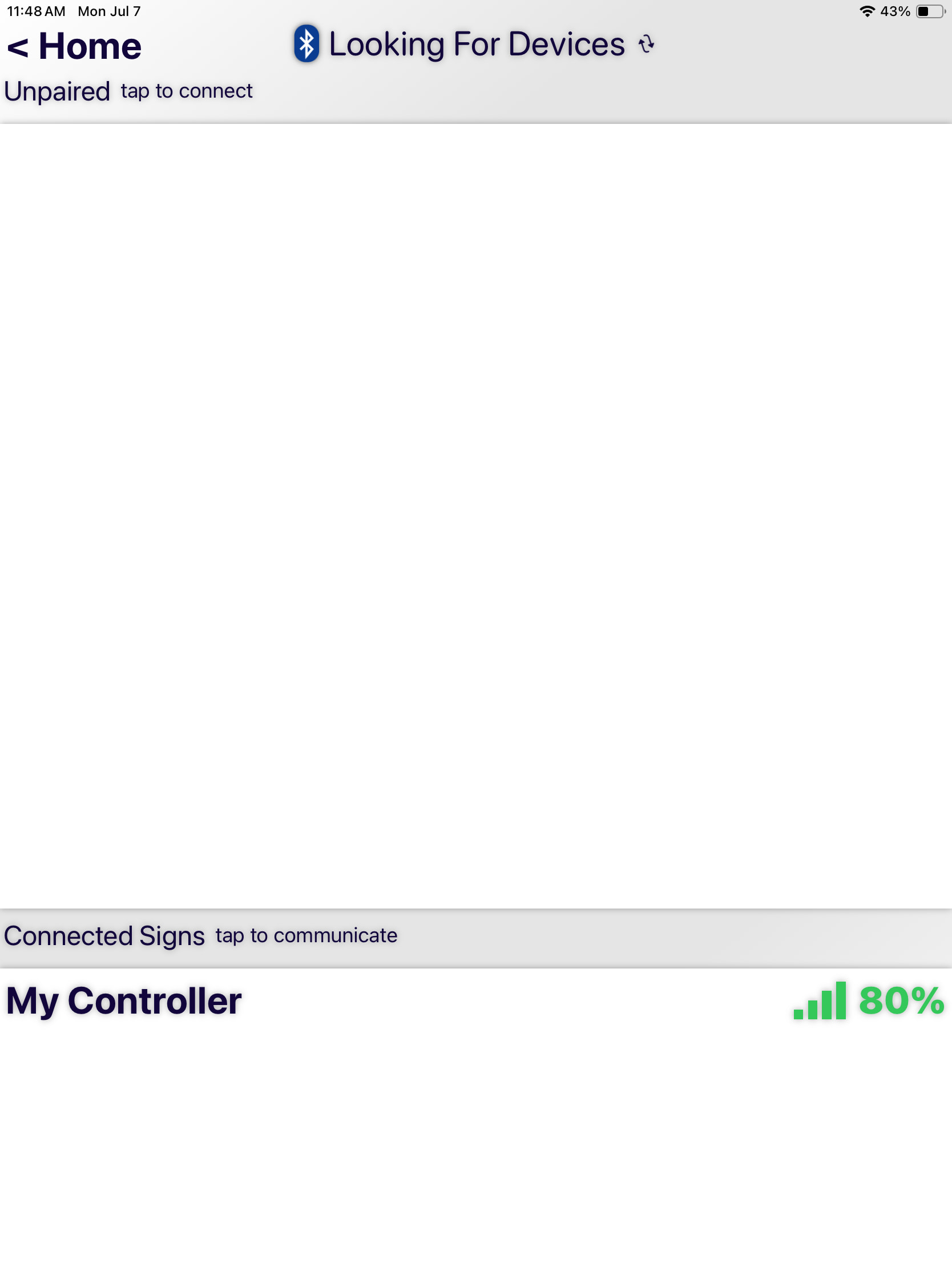 User interface for managing scoring device connections, indicating active scanning for new Bluetooth devices. Shows both unpaired device prompts and a list of currently connected devices with their respective signal strengths.