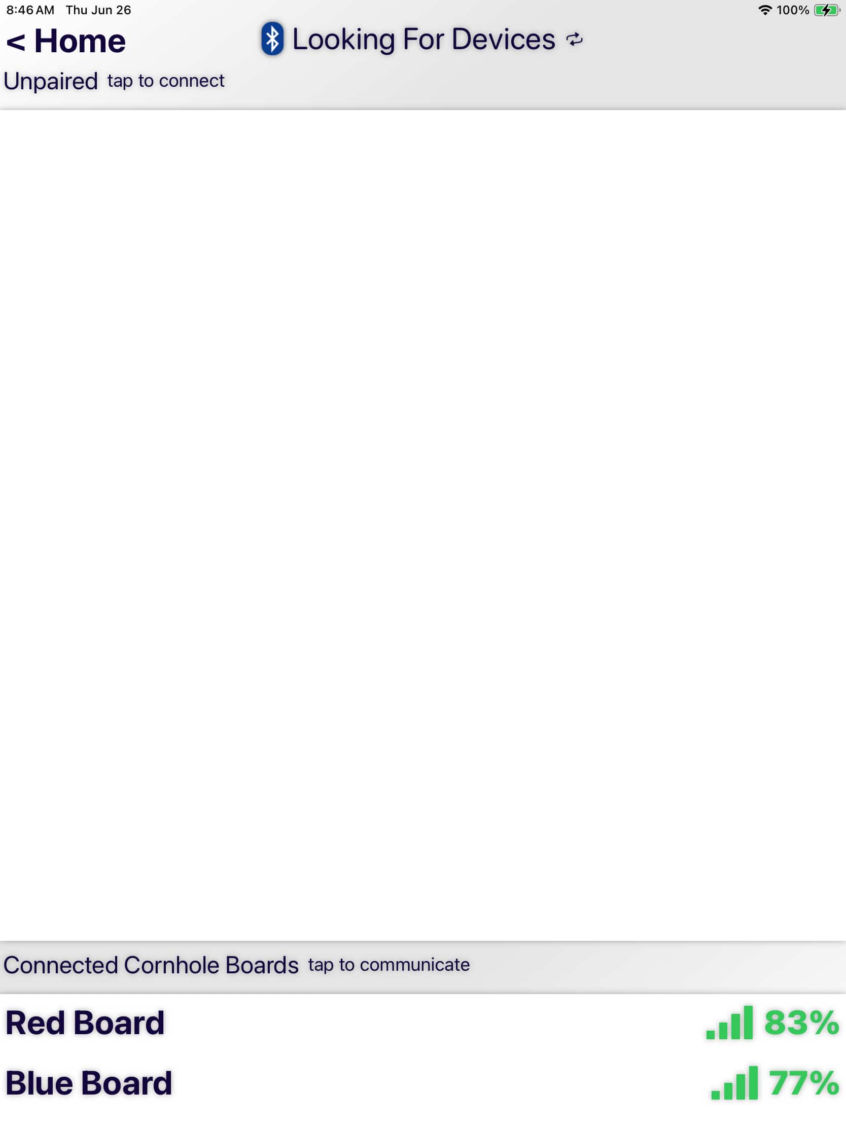 User interface for managing scoring device connections, indicating active scanning for new Bluetooth devices. Shows both unpaired device prompts and a list of currently connected devices with their respective signal strengths.