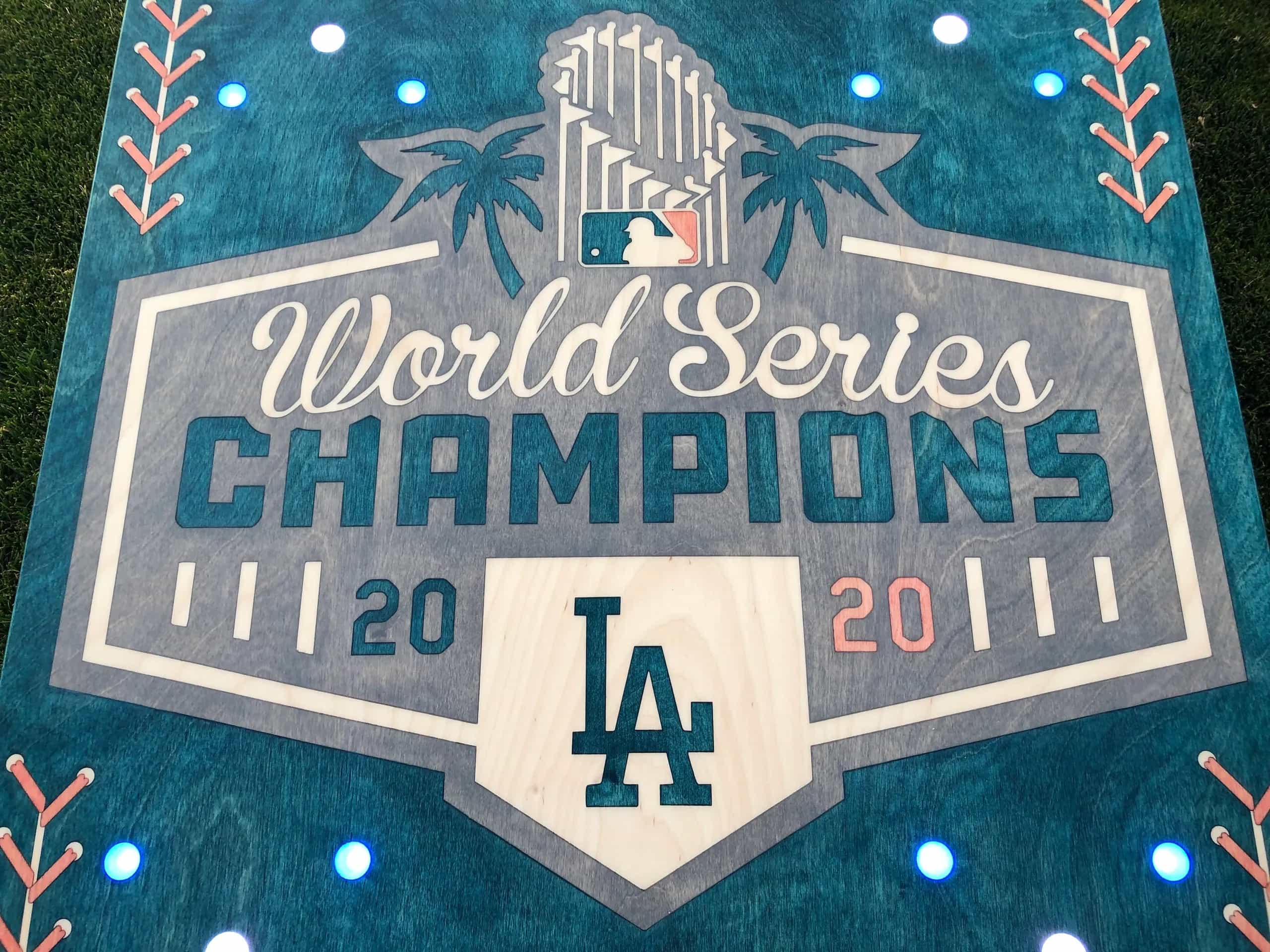 Close-up of a YoreBoard cornhole board with a hand-stained Dodgers 'World Series Champions' logo.