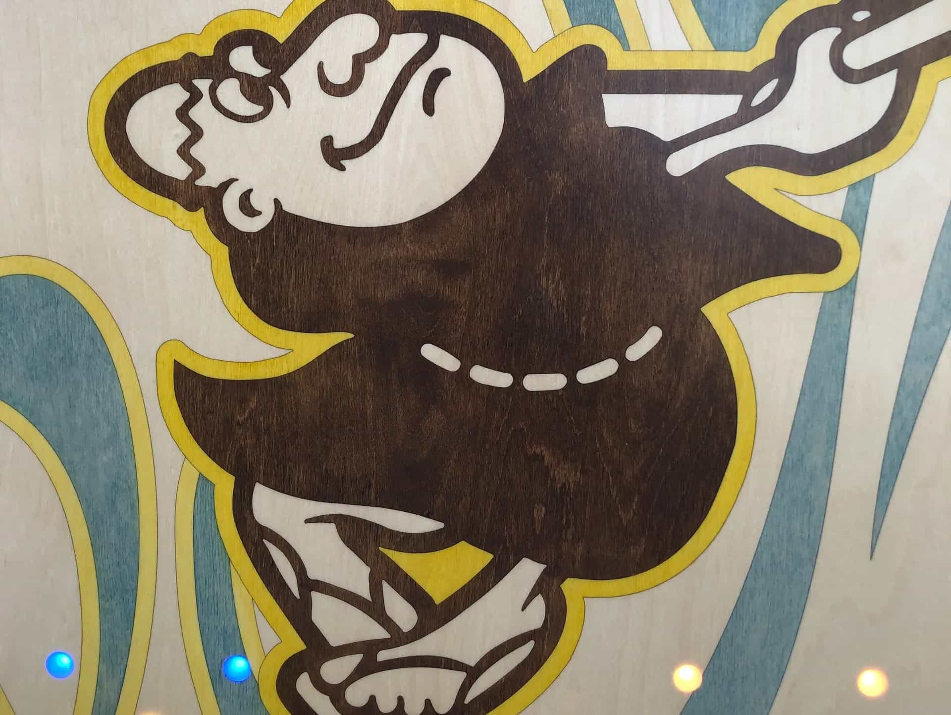 Close-up of a YoreBoard cornhole board with a hand-stained San Diego Padres 'Swinging Friar' mascot.