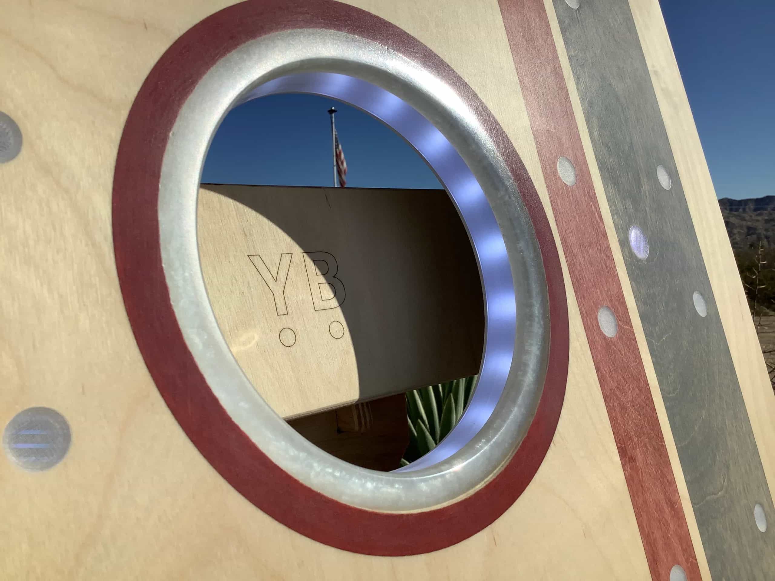 Detailed shot of a YoreBoard cornhole board highlighting the premium illuminated hole, crafted with a smooth epoxy finish and internal lighting.