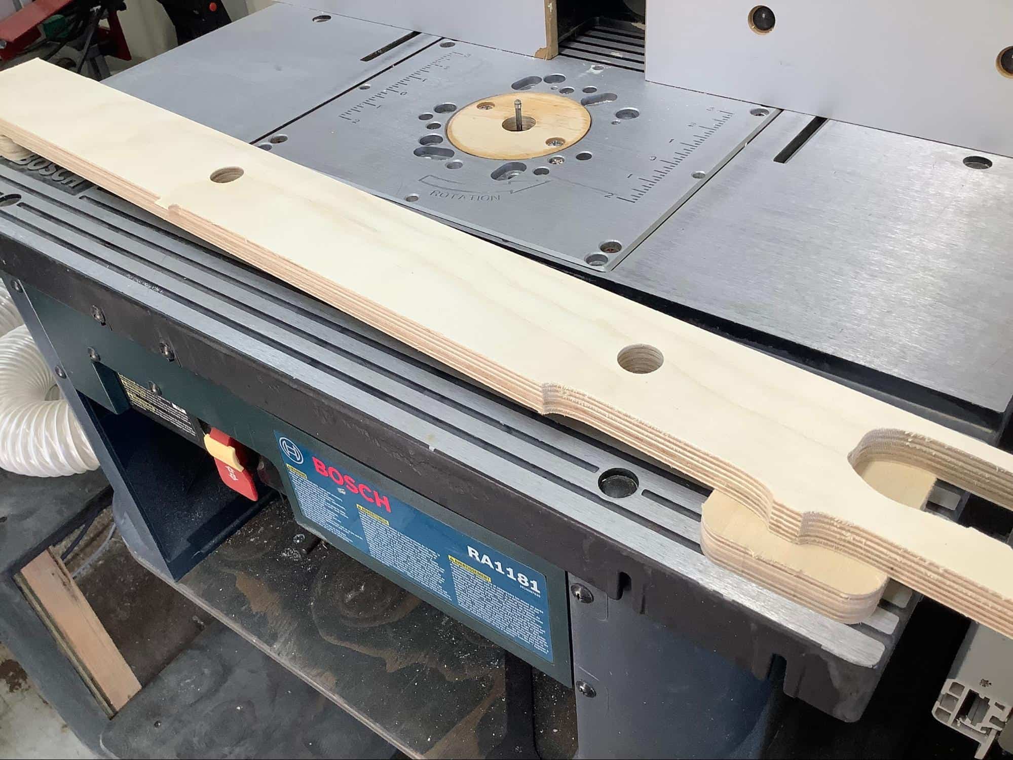 Image showing the preparation for flush routing the assembled foot beed for cornhole boards.