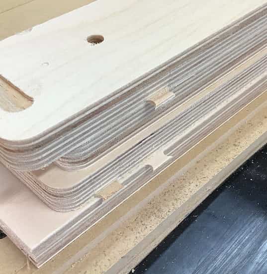 Image showing the leftover tabs from the CNC process on YoreBoard cornhole components.