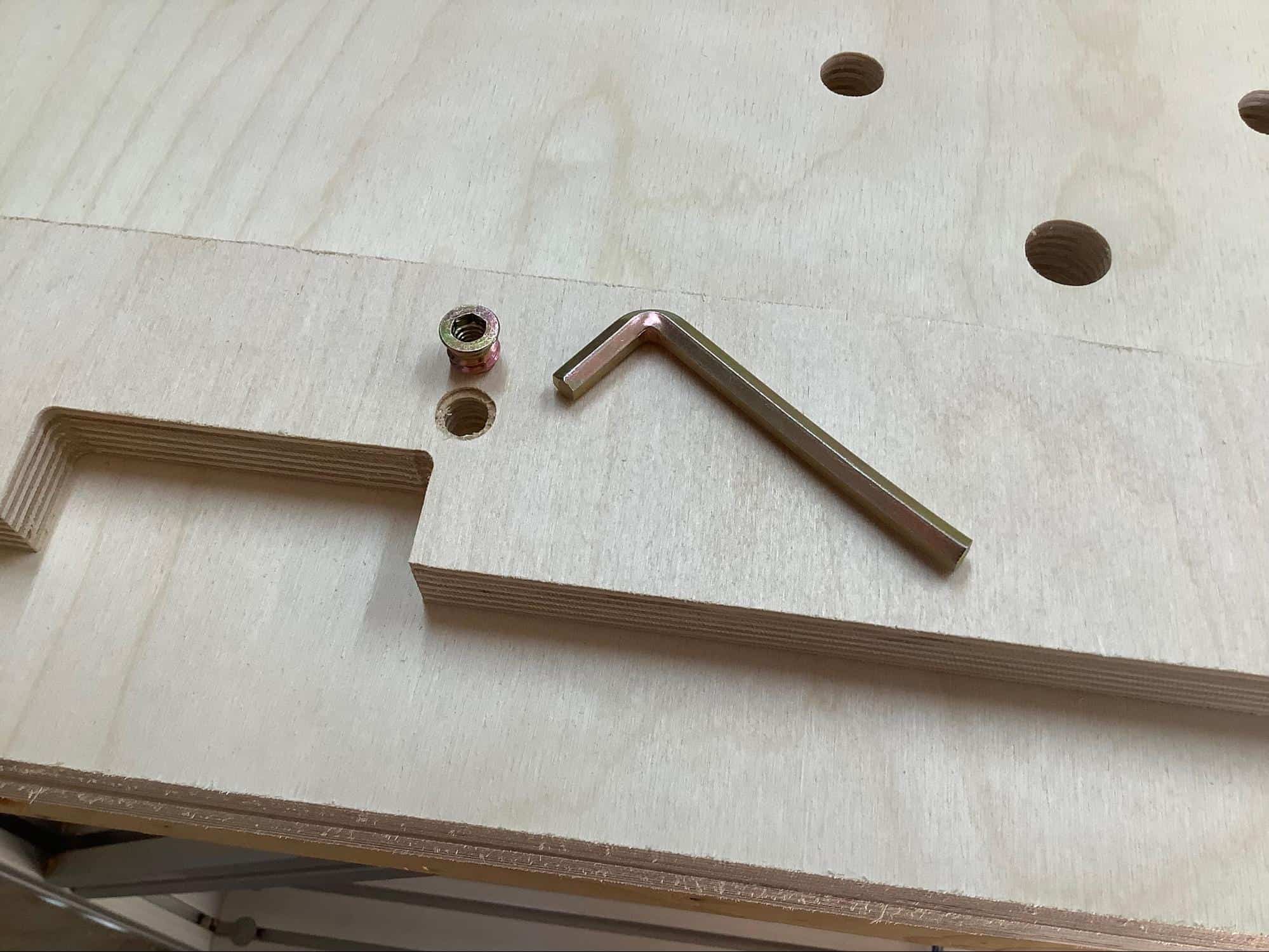 Image showing where to install the insert nut for the power pack lock on a YoreBoard cornhole board.