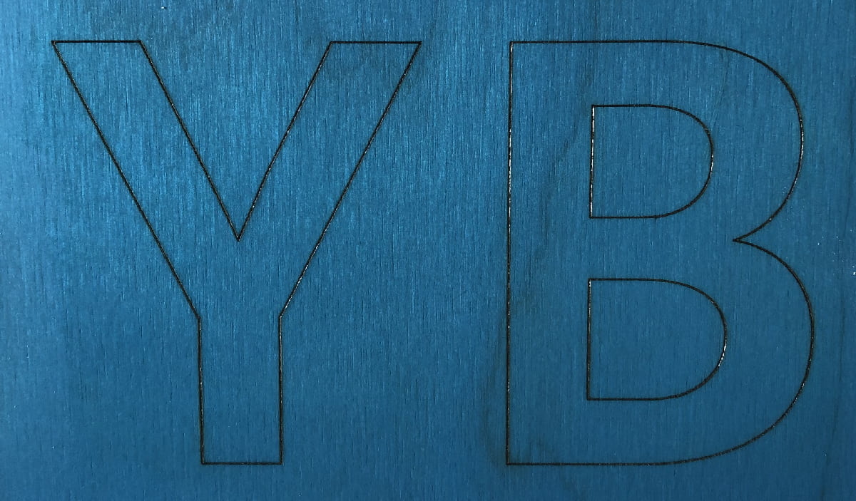 Image of YB logo lasered into staining mask.