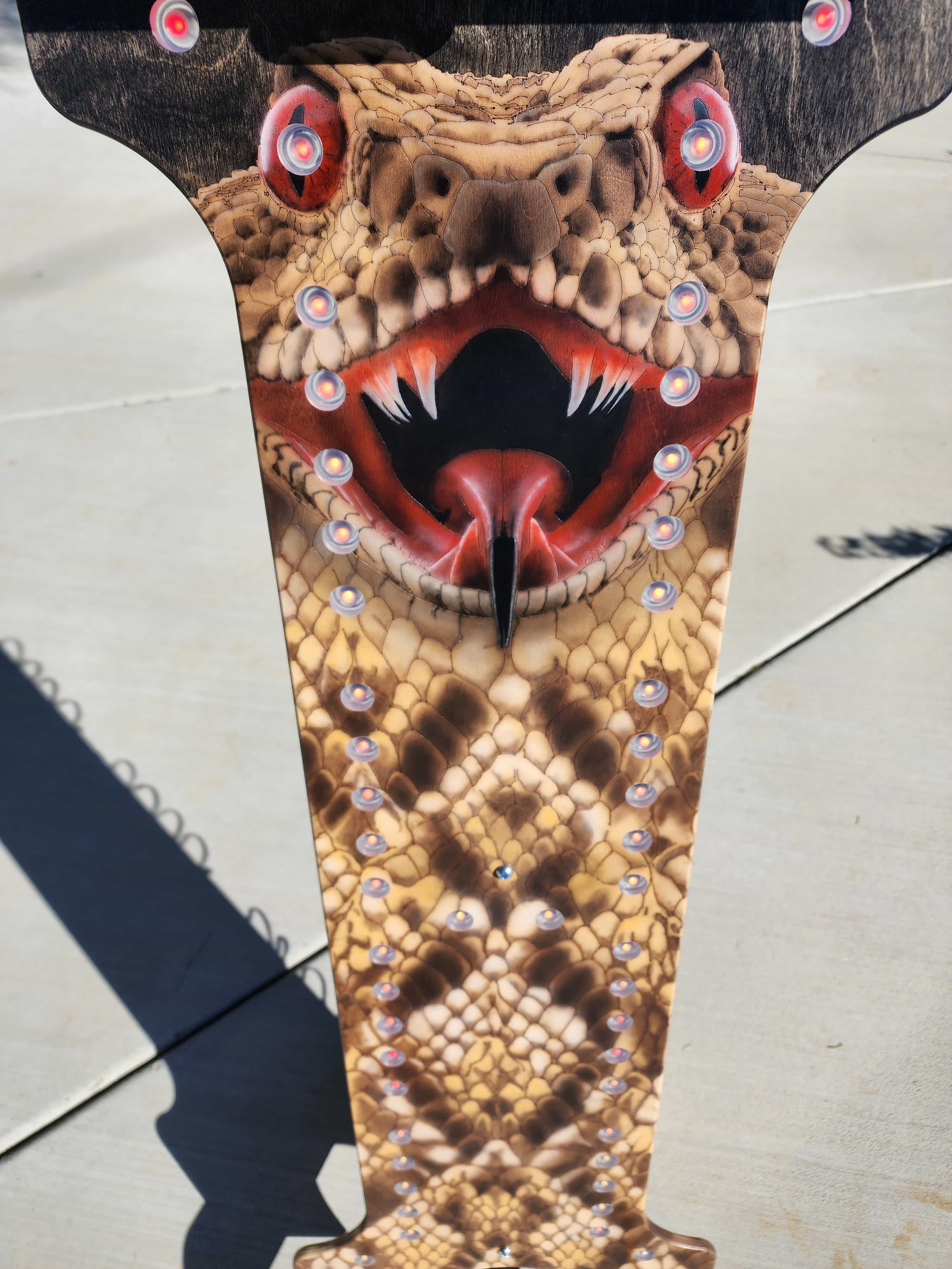 Custom YoreBoard score tower showcasing intricate, realistic rattlesnake graphic with vibrant colors and embedded Scoring LEDs for a fierce look.